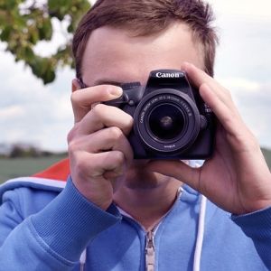 Image of man with DSLR camera